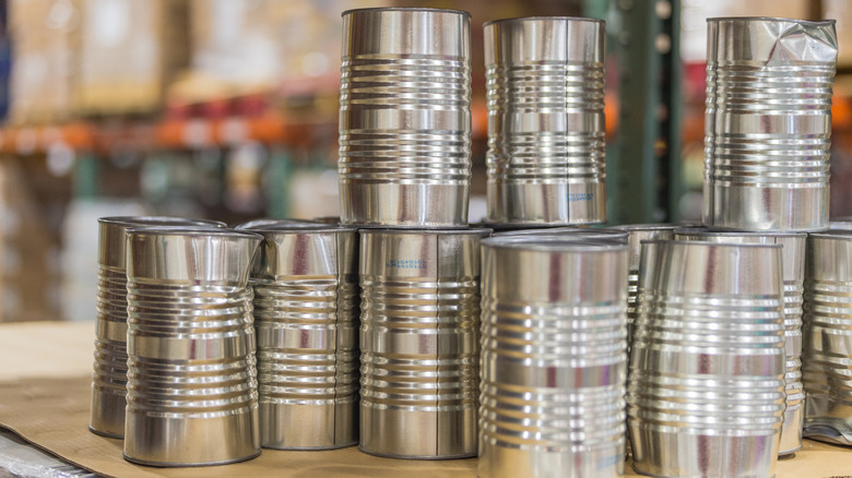 A stack of dented tin cans