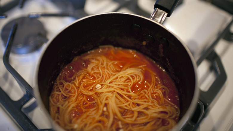 Spaghetti in a pot on the stove