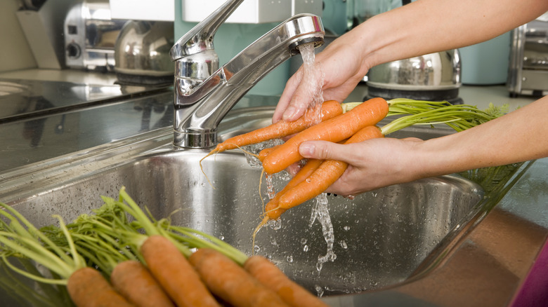 washing produce under faucet water