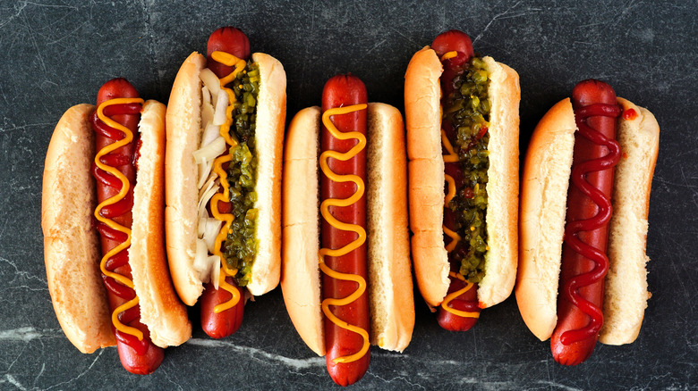 A selection of hot dogs with different toppings