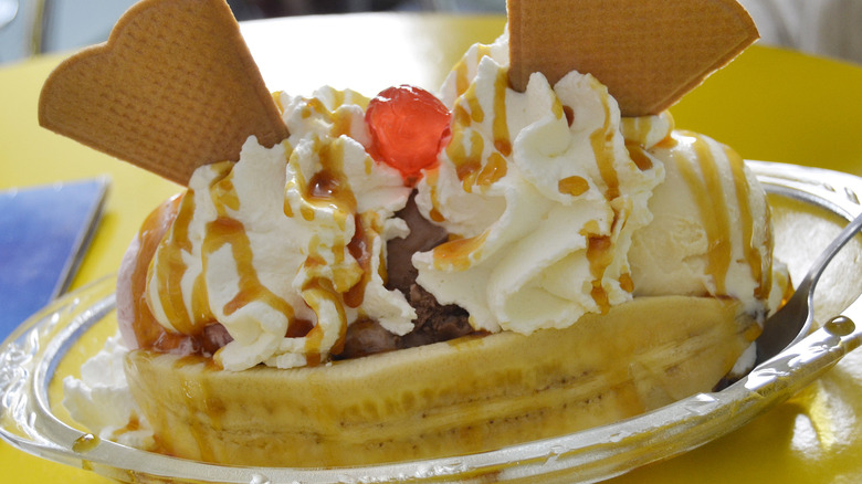 Banana split with whipped cream and waffle cone