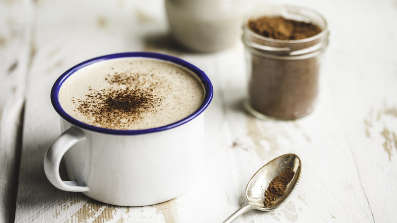 Two mugs of cocoa beverage