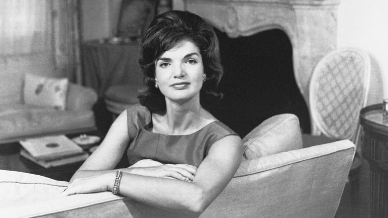 Jackie Kennedy sitting on a couch