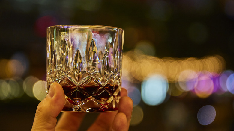 whisky glass held in hand