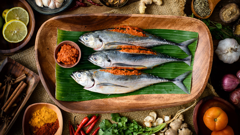 mackerel resting on banana leaf