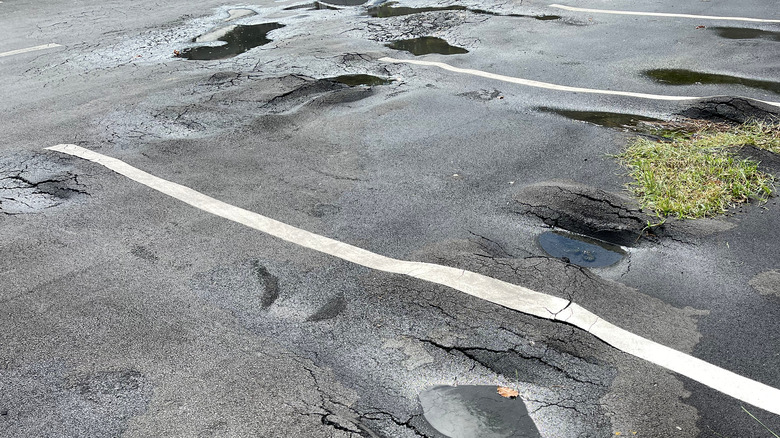 broken asphalt in parking lot