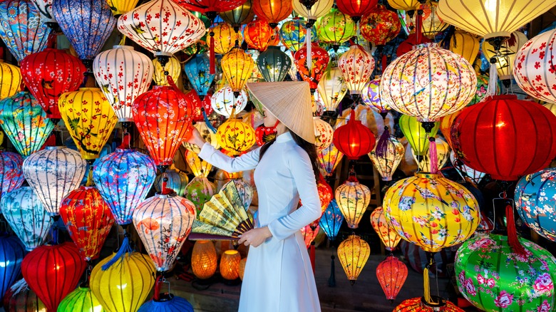 Asian woman surrounded by lanterns