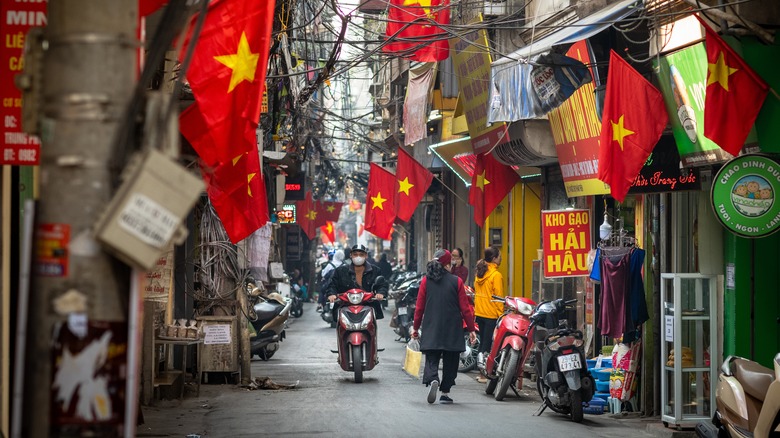 busy Vietnamese street with flags