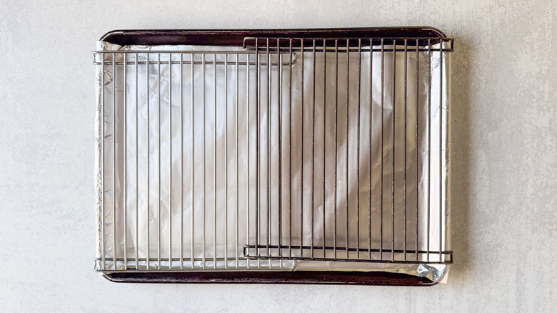 Baking sheet lined with foil and racks