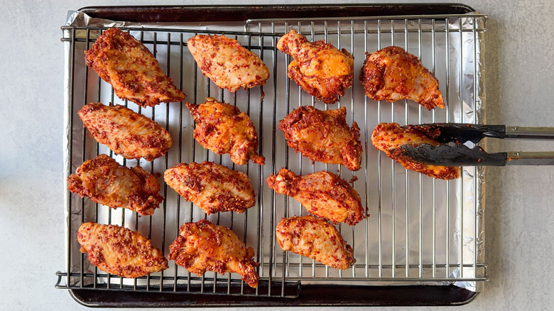 Korean dry-rubbed chicken wings on pan racks
