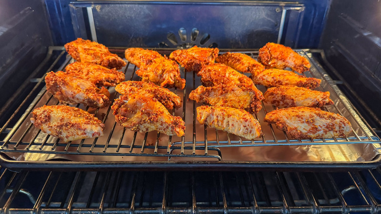 Korean dry-rubbed chicken wings baking in oven