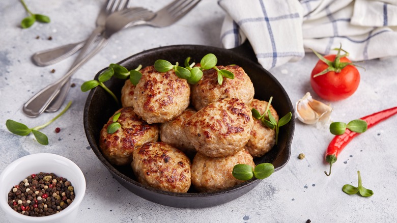 Cooked turkey meatballs in a skillet