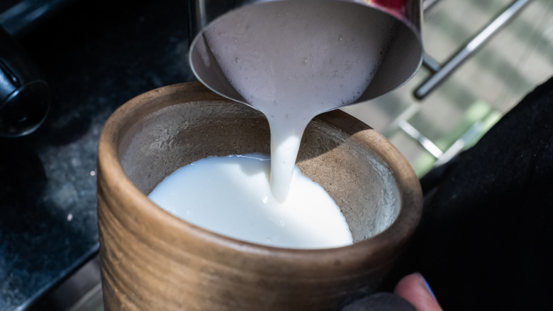 Pouring scalded milk