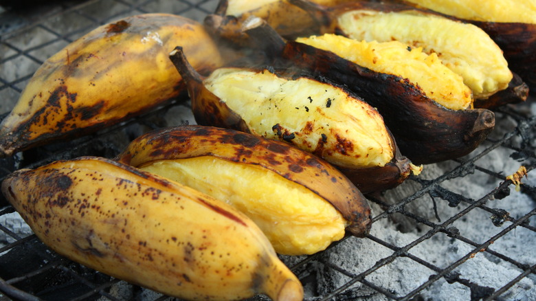 Bananas with the peel on a grill