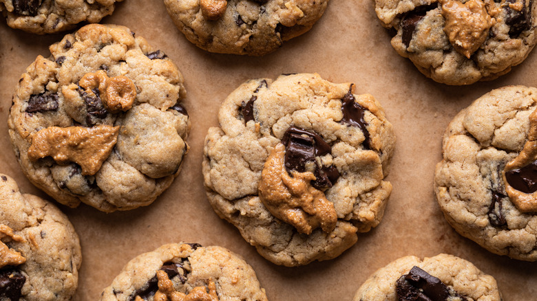 Peanut butter chocolate chip cookies on parchment