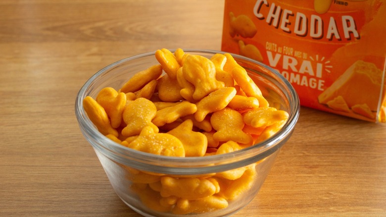 A bowl of Goldfish crackers in front of the open bag