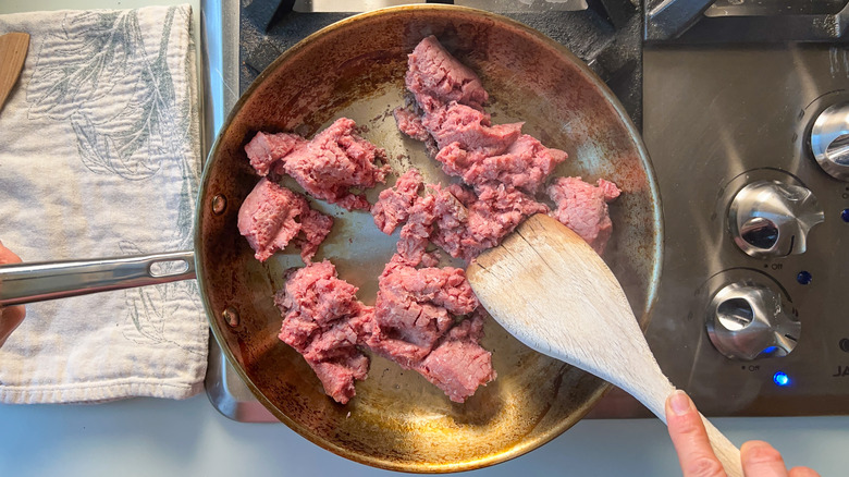 Ground beef in skillet on stovetop