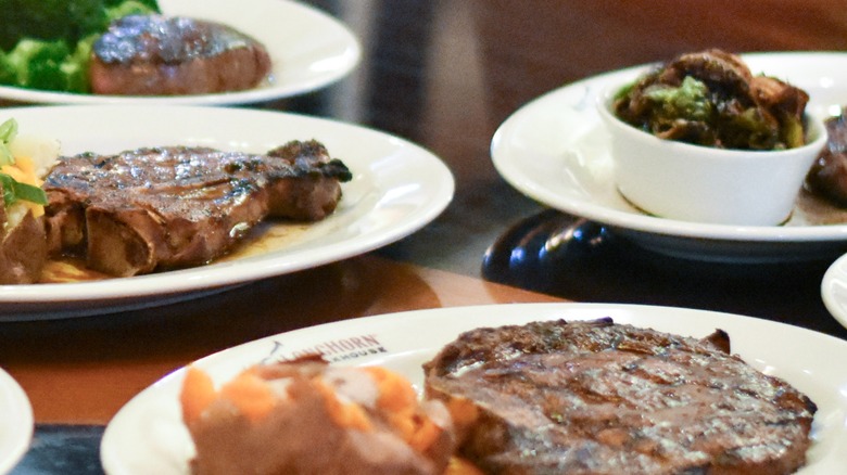 Steaks at LongHorn Steakhouse on white plates