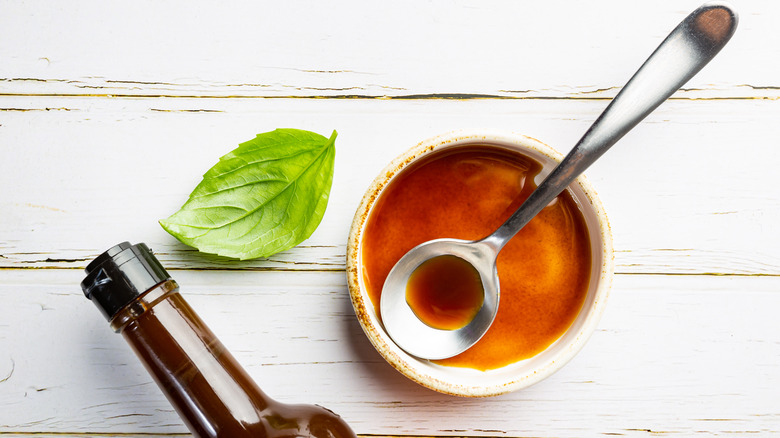 Bowl of Worcestershire sauce with spoon 