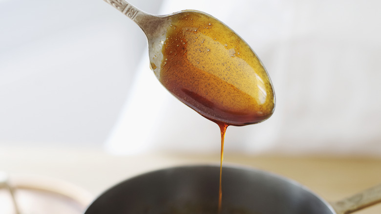 brown sugar syrup dripping off spoon