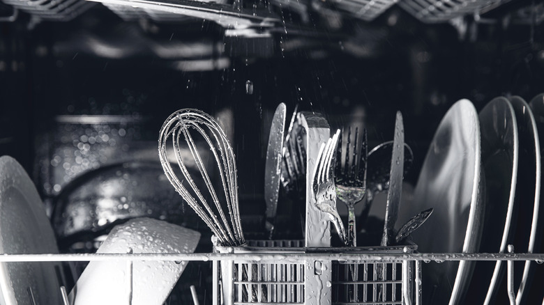 A view into a dishwasher full of dishes.