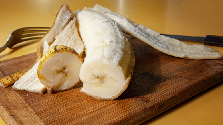 Peeled banana cut in half