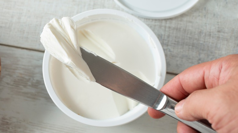 Cream cheese on a knife