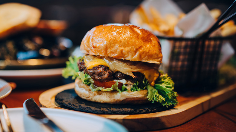 Cheeseburger on wooden board