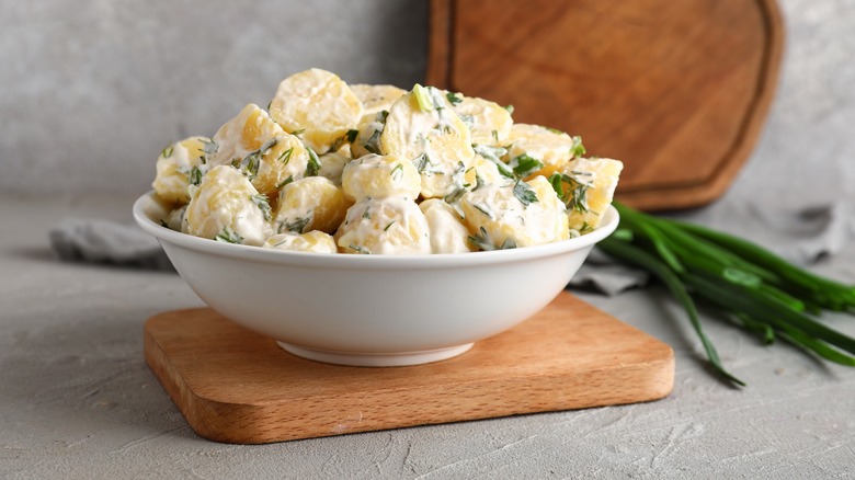 Potato salad in white bowl