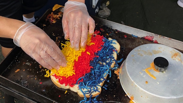 Laying out rainbow colored cheese