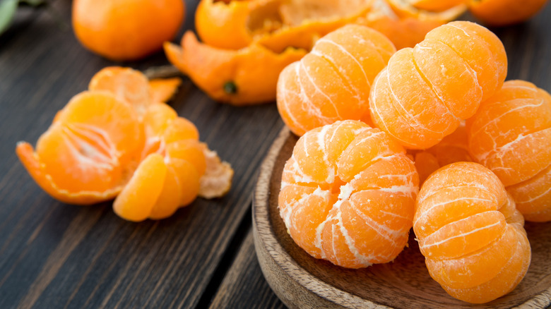 Peeled clementines on a plate.