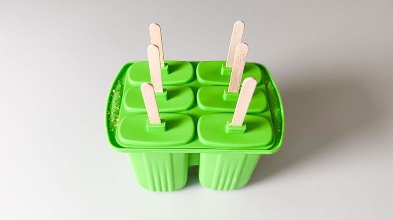 Green popsicle molds with sticks