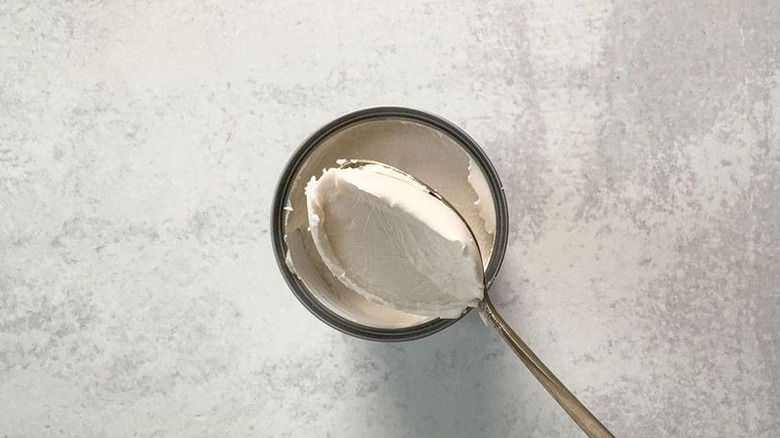 Spooning coconut cream from can