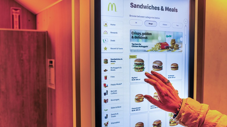 Woman orders from McDonald's on digital screen