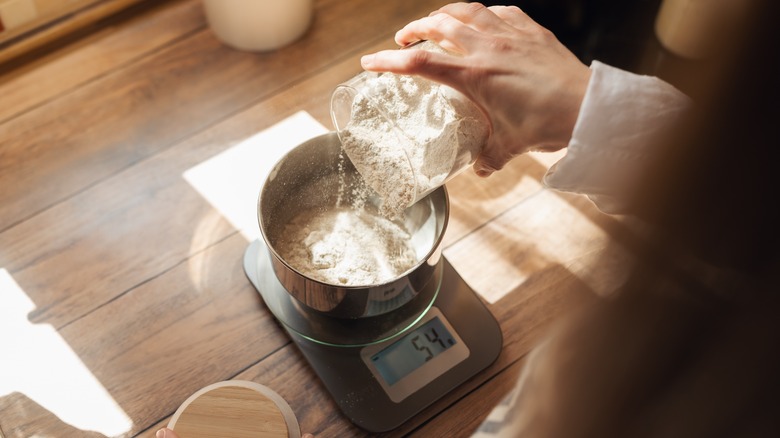 Measuring flour on kitchen scale