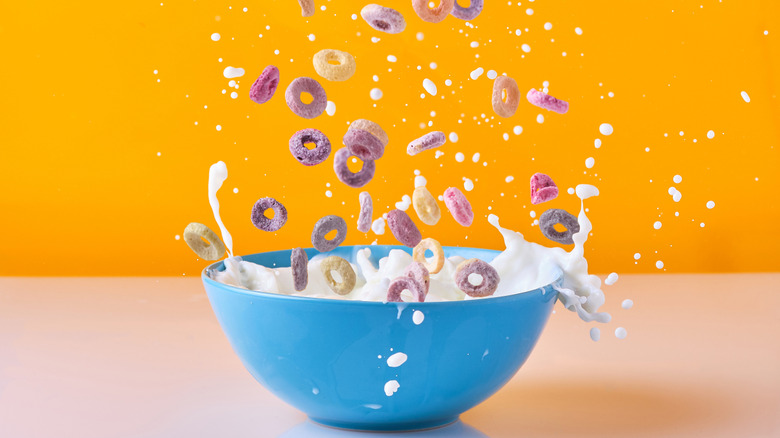 Milk and cereal splashing from a bowl