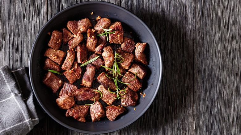 Beef cubes in frying pan