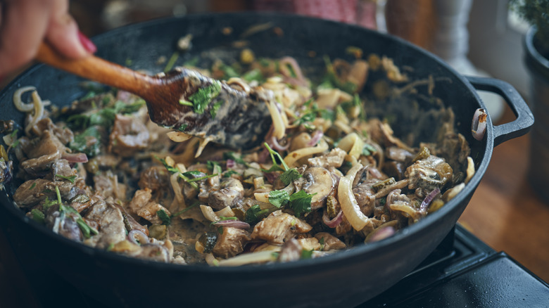 Person cooking Stroganoff