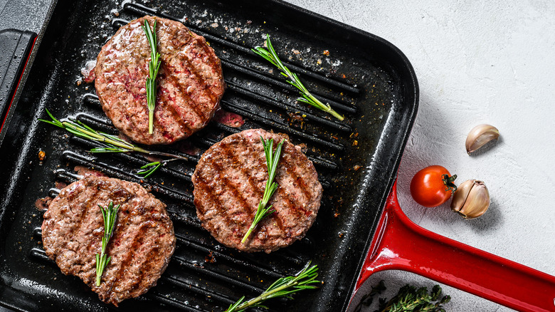 Ground beef browning in skillet