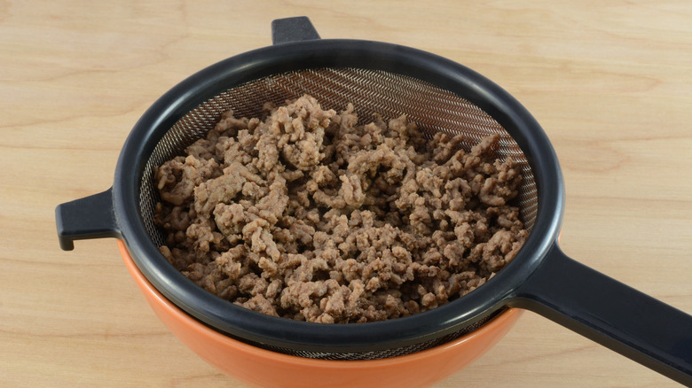 Ground beef over strainer