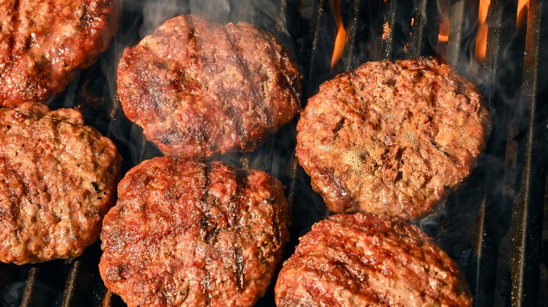 Seared burger patties on grill