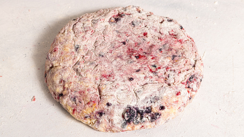 Mixed berry scones dough shaped into a disk