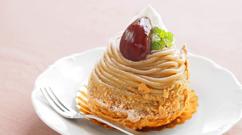 A tall mont blanc dessert on a plate