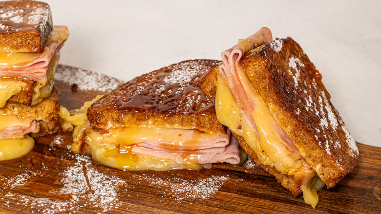 Two slices of Monte Cristo sandwich, one half leaning on the other