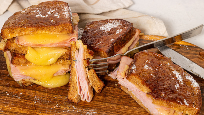 Sliced Monte Cristo sandwiches with a fork between them