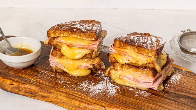 Two Monte Cristo sandwiches in half and stacked on top of each other