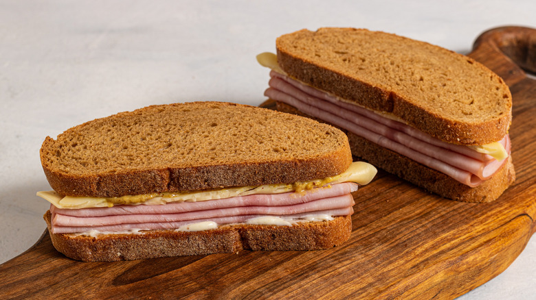 Two sandwiches with ham and cheese