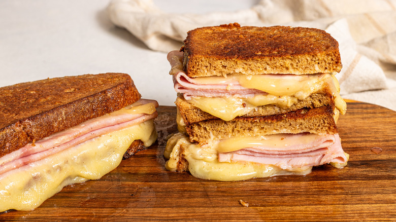 Two monte cristo sandwiches, one sliced and stacked on top of each half