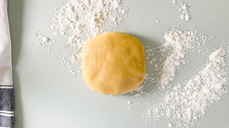 Quiche dough on floured counter top