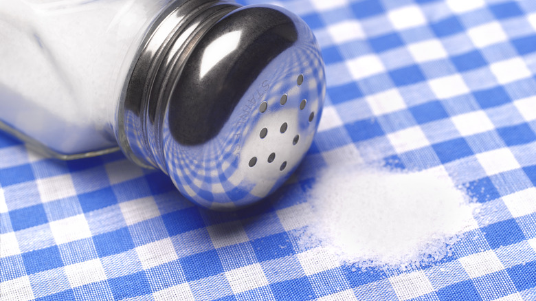 Spilled salt on a checkered tablecloth